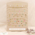 Display of 12 shell steel anklets 0223179: Multi