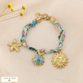 Bohemian floral fabric steel bracelet with charms knotted 0225038: Blue